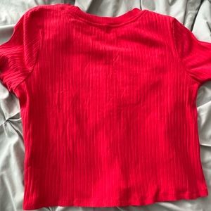 red t-shirt white a tie in front